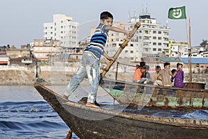 Dhaka, Bangladesh, February 24 2017: Close-up view of a young rudder in a wooden taxi boat
