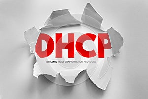 DHCP acronym in bold text breaks through torn paper, symbolizing the Dynamic Host Configuration Protocol