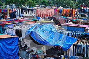 Dhobi Ghat is an open air laundromat lavoir in Mumbai, India with laundry drying on ropes