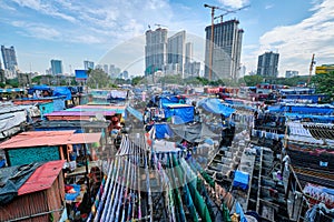 Dhobi Ghat is an open air laundromat lavoir in Mumbai, India with laundry drying on ropes