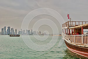 Dhows, the traditional boats, and, in the background, West Bay skyline. Doha. Qatar