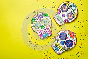 Dia de los muertos concept - skull shaped cookies with colorful decorations photo