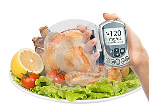 Diabetes concept glucose meter garnished roasted chicken meal