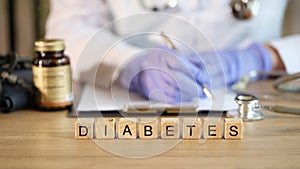 Diabetes word made with wooden cubes in row