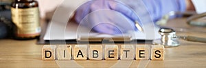 Diabetes word made with wooden cubes in row