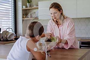 Diabetic boy with a continuous glucose monitor is careful with his diet.