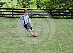 Diabetic Boy playing soccer photo