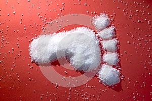 Diabetic foot made of sugar photo