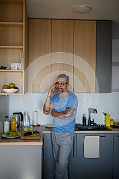 Diabetic man with CGM sensor making phone call.