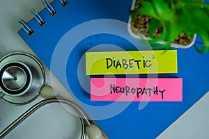 Diabetic Neuropathy write on sticky notes isolated on Wooden Table