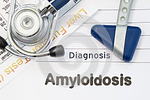 Diagnosis Amyloidosis. Neurological hammer, stethoscope and liver laboratory test lie on note with title of Amyloidosis. Concept f