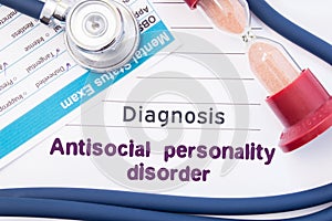 Diagnosis of Antisocial personality disorder ASPD. On psychiatrist or psychologist table is paper with inscription Antisocial pe