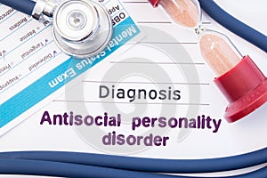 Diagnosis of Antisocial personality disorder ASPD. On psychiatrist or psychologist table is paper with inscription Antisocial pe photo