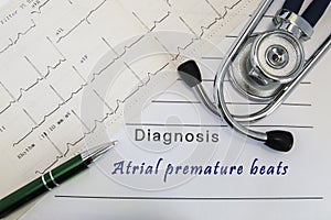 Diagnosis of Atrial premature beats. Stethoscope, green pen and electrocardiogram lie on medical form with diagnosis of Atrial pre