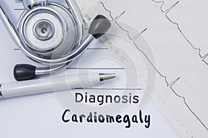 Diagnosis of cardiomegaly. Stethoscope, printed electrocardiogram and pen are on paper medical form where indicated cardiological