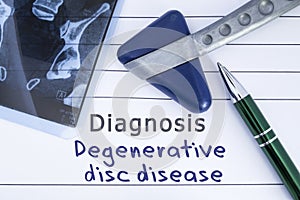 Diagnosis degenerative disc disease. Medical health history written with diagnosis of Lumbar disc disease, MRI image sacral spine