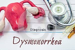 Diagnosis of Dysmenorrhea. Medical history of patient with Diagnosis of Dysmenorrhea inscription next stethoscope, uterus with ova