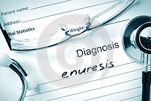 Diagnosis Enuresis and stethoscope.