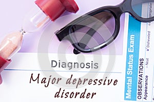 Diagnosis of Major Depressive Disorder. Hourglass, doctor glasses, mental status exam are near inscription Major Depressive Disord