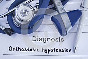 The diagnosis of orthostatic hypotension. Paper medical history with diagnosis of orthostatic hypotension, on which lie blue steth photo