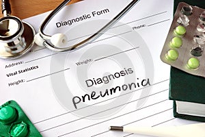 Diagnosis pneumonia and stethoscope. photo