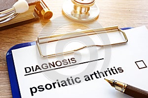 Diagnosis psoriatic arthritis and clipboard. photo