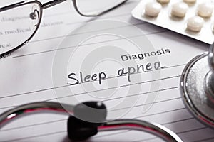 Diagnosis Sleep Apnea Word On Paper With Drugs And Stethoscope photo