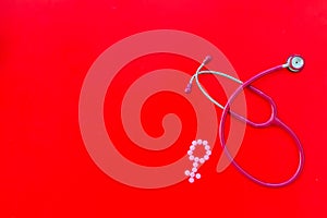 Diagnostic and cure of gynaecological disease with stethoscope and female symbol on red background top view mock-up