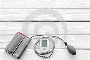 Diagnostics of cardiac disease with pulsimeter on white wooden background top view copyspace