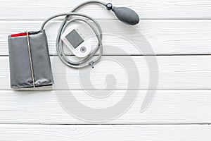 Diagnostics of cardiac disease with pulsimeter on white wooden background top view mockup