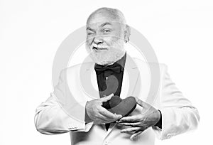 Diagnostics and treatment. Health care. Preventing heart attack. Senior bald head bearded man holding red toy heart in