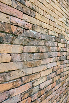 Diagonal corner of old red brick wall, wallpaper texture background