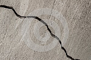 Diagonal crack in plaster on a wall