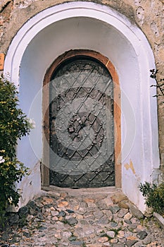 Diagonal Decorated Plank And Padlock On Medieval Metal Door