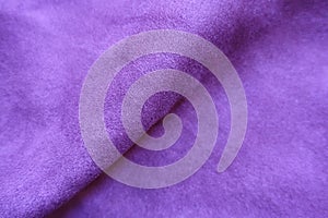 Diagonal fold on violet faux suede