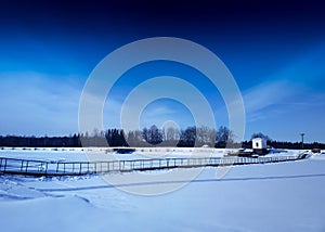 Diagonal hinged bridge over frozen river landscape background