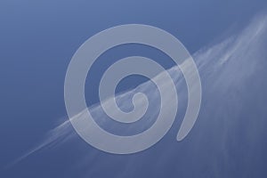 Diagonal line pattern abstract nature of white clouds and blue sky background. Cirrus clouds on blue sky