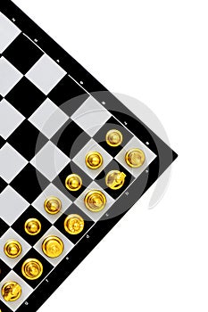 Diagonal over view of a chess board and golden pieces  