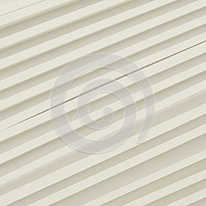 Diagonal rows of parallel white lines create an abstract, geometric pattern. The lines