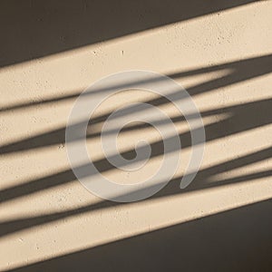 Diagonal shadows cast on a textured beige wall create a pattern of parallel lines. The shadows