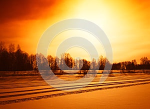 Diagonal snowmobile roads on frozen river landscape background