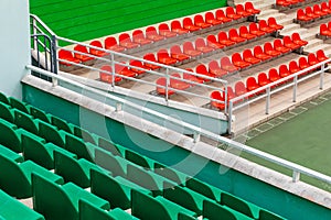 Diagonal view of competition venue with green and orange spectator seats