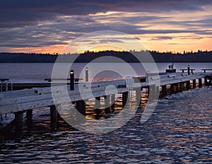 A diagonal view of a pier on a lake in a winter sunset at Waverly Beach Park, Washington