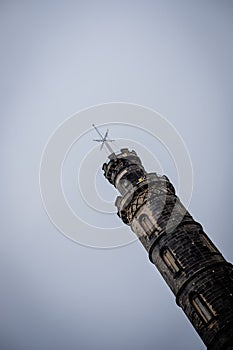 Diagonal view of Vice Admiral Horatio Nelson Monument on top of Calton Hill in Edinburgh, Scotland, UK, on a cloudy day