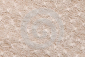 Diagonally knitted background with a braided recurring homogeneous pattern. photo