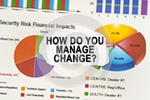 On diagrams and graphs lies torn paper with the inscription - How Do You Manage Change