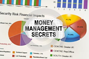 On diagrams and graphs lies torn paper with the inscription - Money Management Secrets