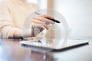 Diagrams and graphs on virtual screen. Business strategy, data analysis technology and financial growth concept.