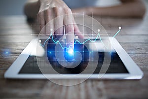 Diagrams and graphs on virtual screen. Business strategy, data analysis technology and financial growth concept.