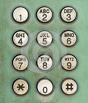 Dial number button on old used public telephone